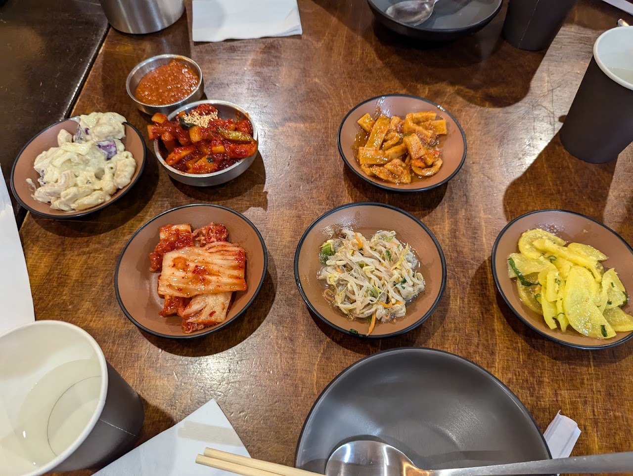 Banchan side dishes on a timber table